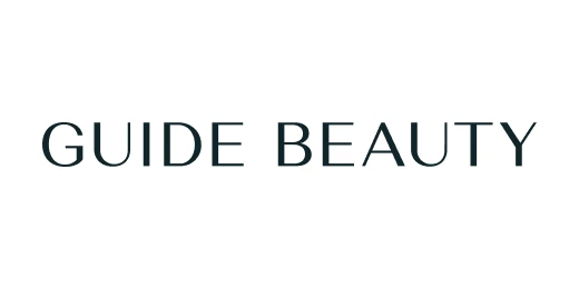 Guide beauty written in uppercase stylish thin typeface in black on white